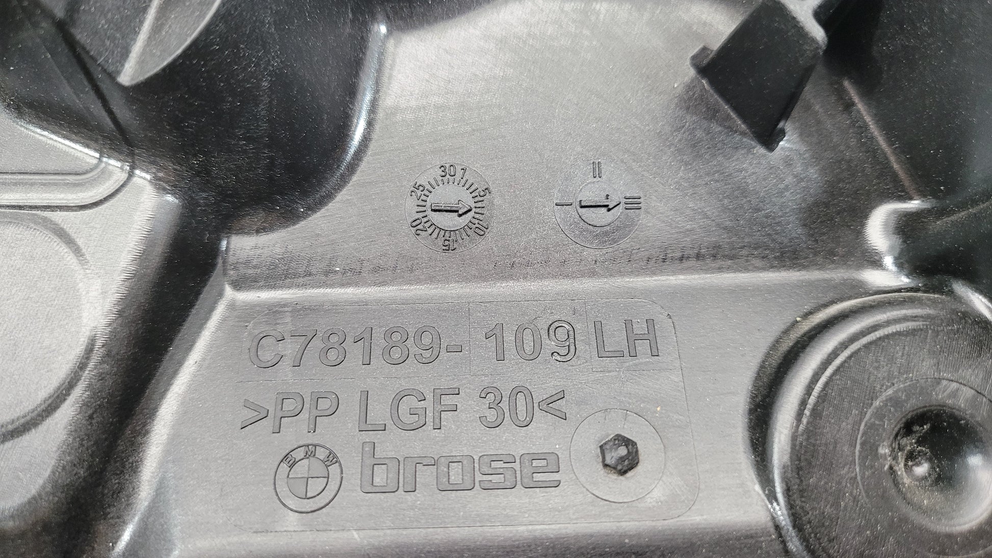 BMW M3 Series G20/G8x rear left window regulator and motor, part 7432235, with visible metal components and wiring.