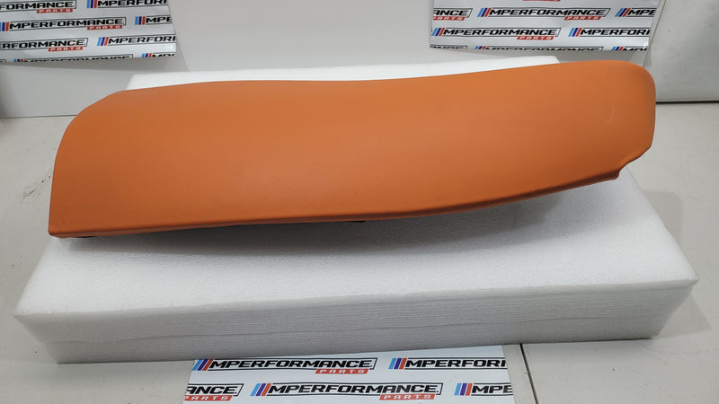 G80 M3 Kyalami Orange left rear seat bolster from MPerformance.parts, showing close-up of textured upholstery and stitching details.