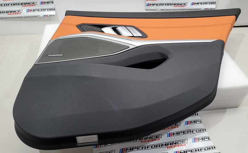 BMW G80 M3 Kyalami Orange driver rear doorcard with detailed stitching and MPerformance branding, showcasing premium automotive interior design.
