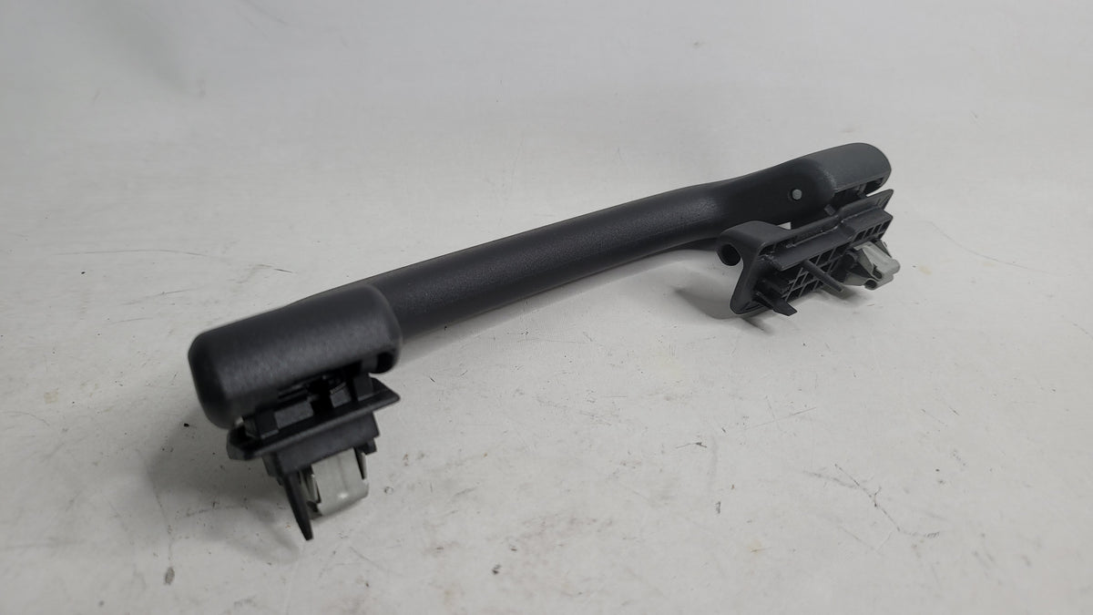 BMW MPerformance.parts 05562 automotive part, close-up of black metal component for BMW vehicle repair or customization.