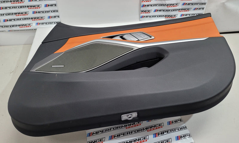 G80 M3 Kyalami Orange driver front door card with black trim, showcasing the MPerformance.parts branding and sleek interior design.