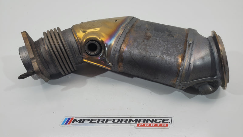 BMW S55 F8x rear exhaust catalytic converter by MPerformance.parts, showing the metal body and inlet/outlet ports.