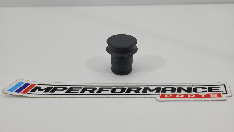 BMW cigarette lighter plug socket cover from MPerformance.parts, showing a black protective cover for the vehicle's cigarette lighter socket.