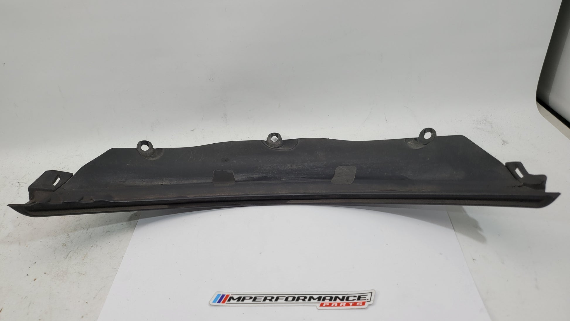 BMW M3 G80 G81 rear left driver side wheel arch trim flaring by MPerformance.parts, showing the black plastic wheel arch extension.