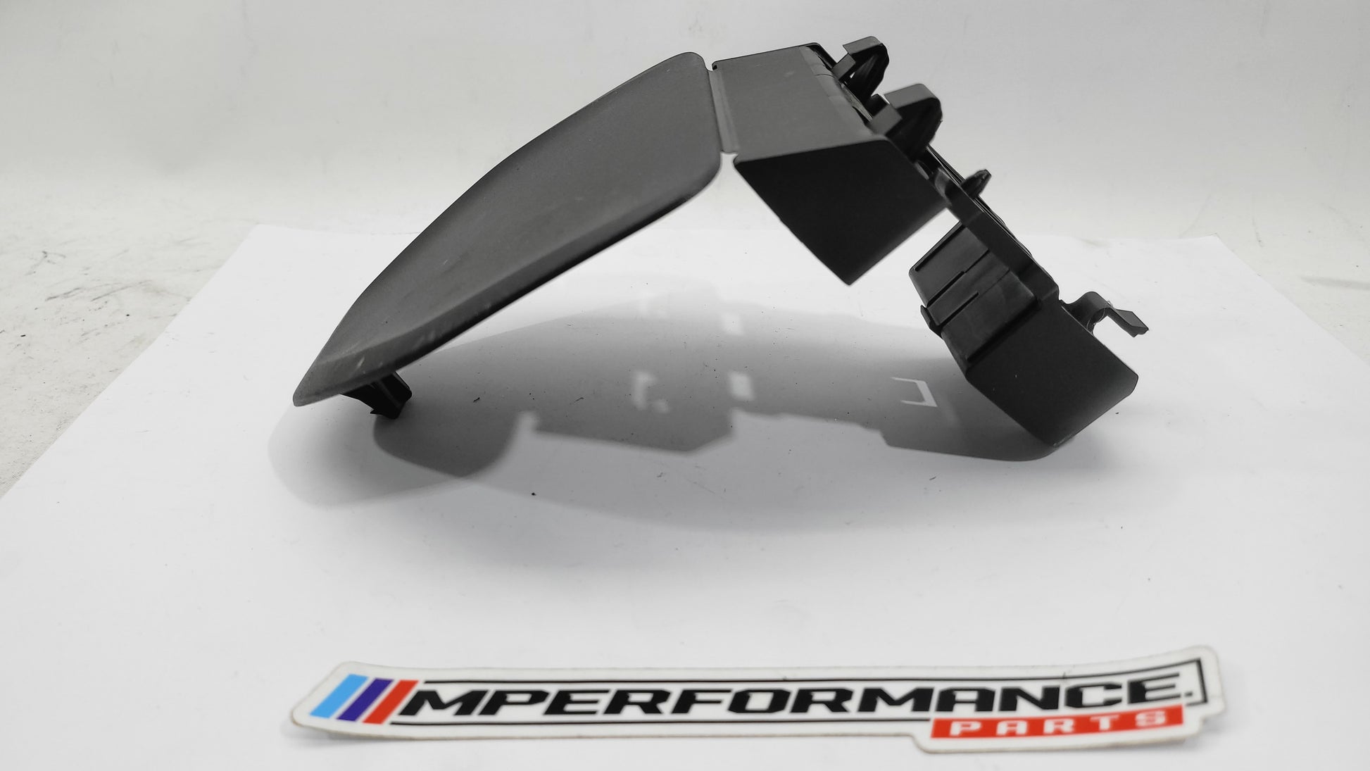 BMW G20 G30 F90 G11 G12 warning triangle carrier bracket with mounting hardware, designed for MPerformance.parts vehicle accessory.