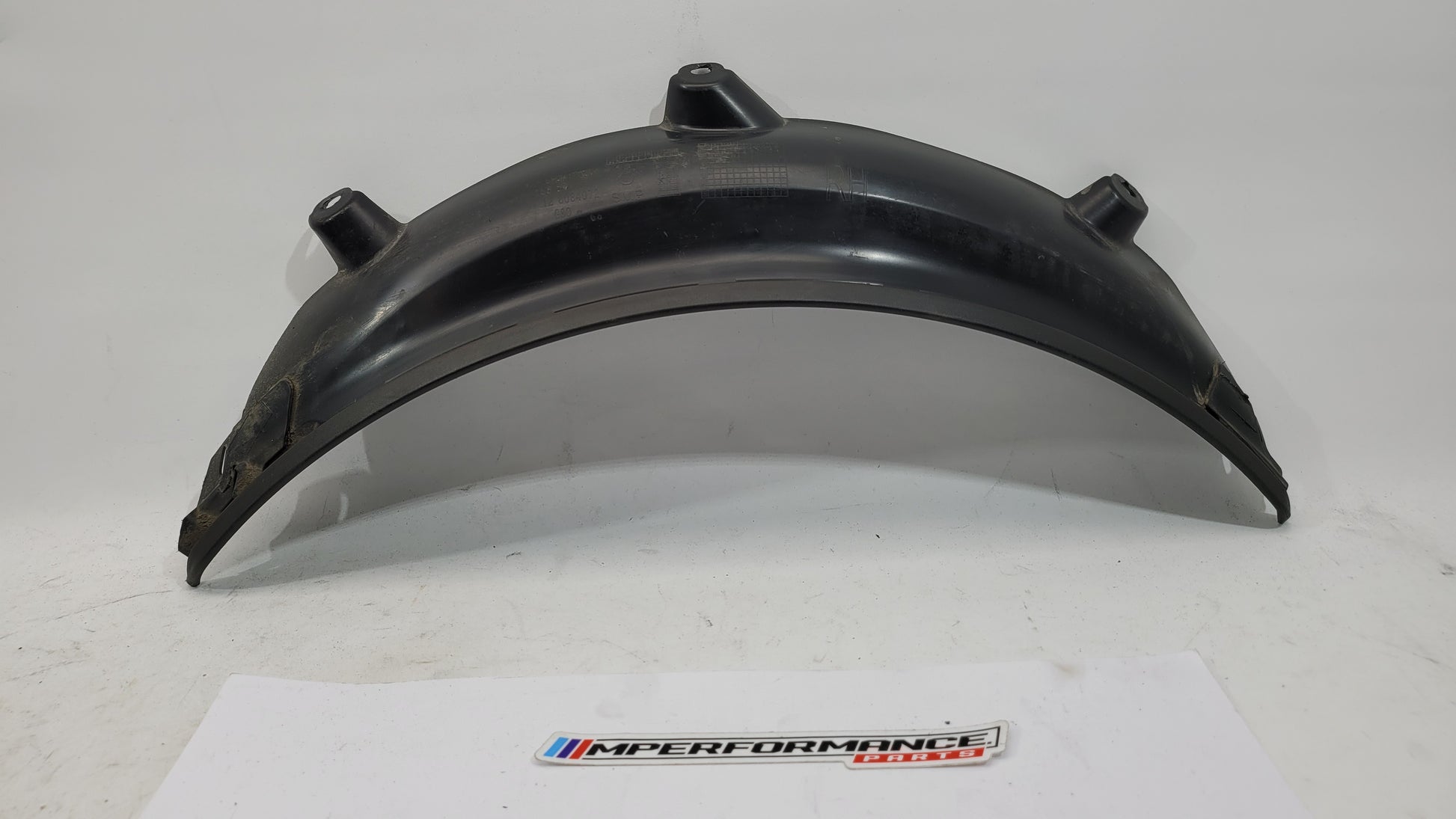 BMW M3 G80 G81 rear side wheel arch trim flaring by MPerformance.parts, showing close-up of the black plastic wheel arch extension.
