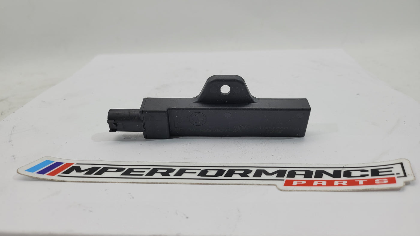BMW M3 F80 interior keyless access antenna module, showing the small electronic component with connectors and circuit board details.