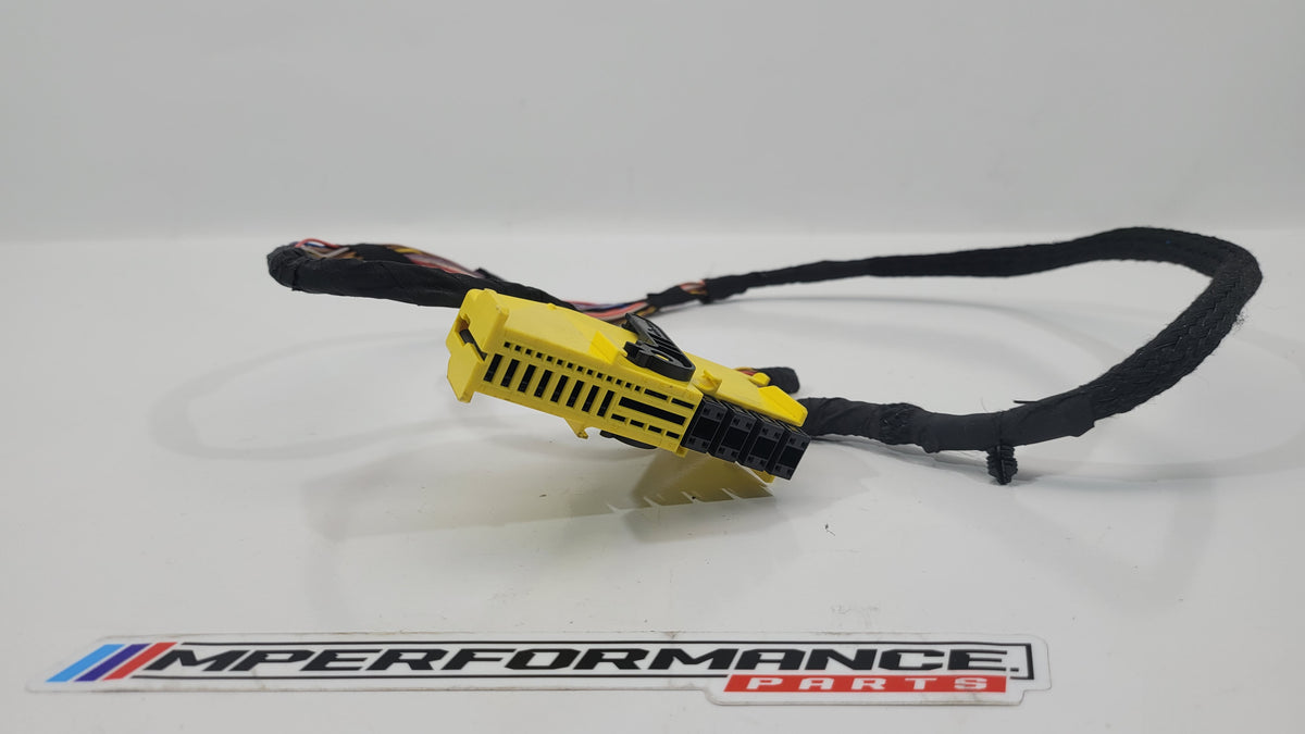 MPerformance.parts flag plug with blue and white design, small automotive accessory with branding details visible.