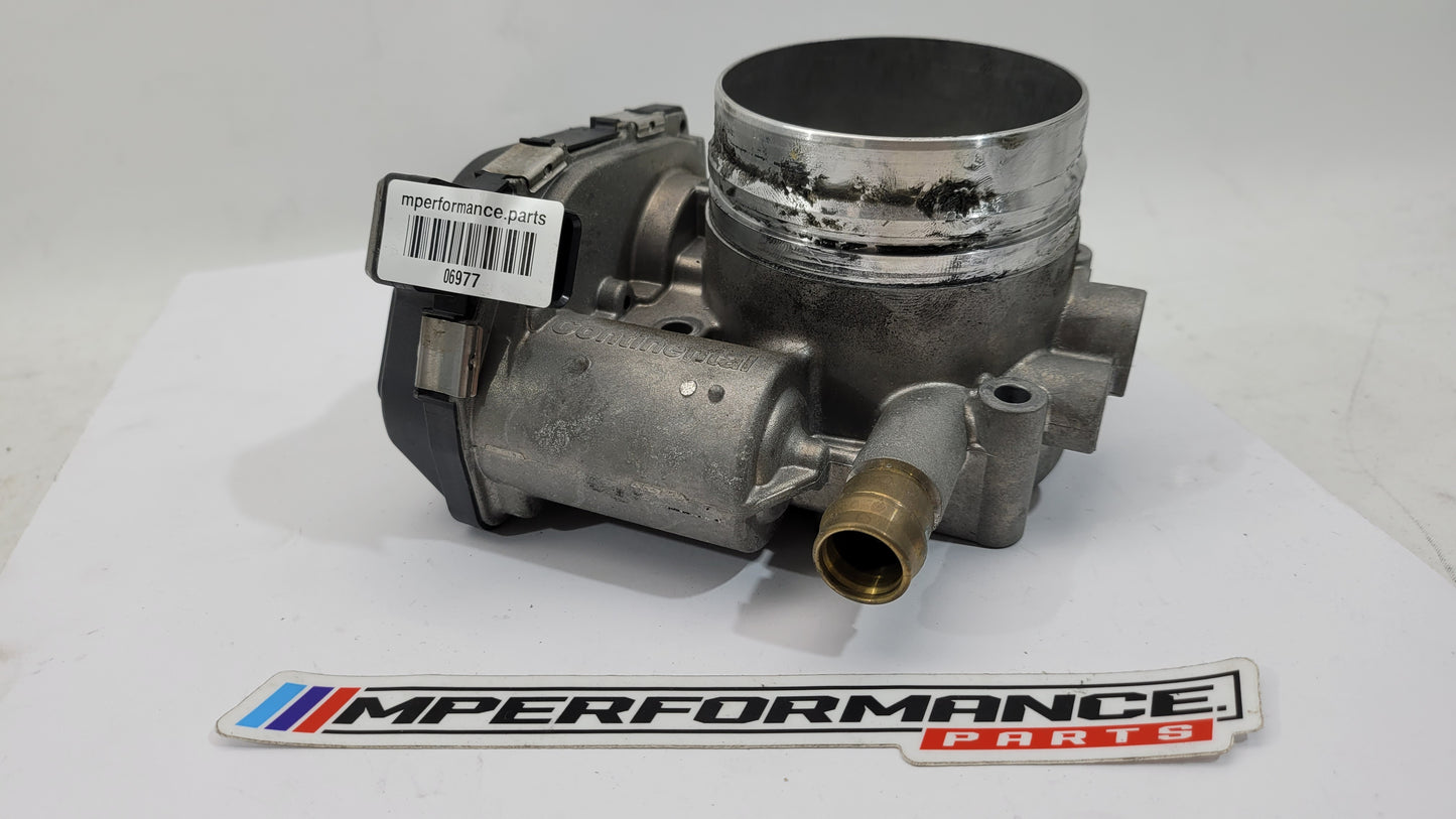 BMW M3 M4 F80 F82 F83 S55 engine throttle body by MPerformance.parts, showing the black metal component with mounting points.