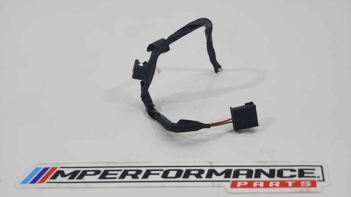 MPerformance.parts flag plug, small black rubber automotive accessory with branding detail, designed for vehicle use