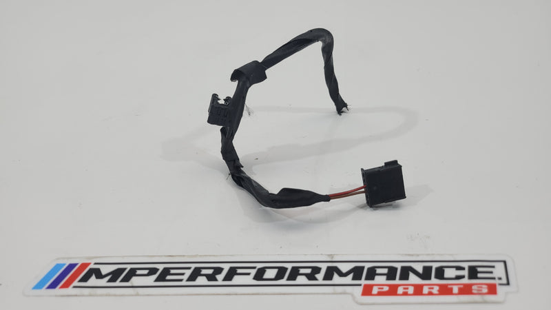 MPerformance.parts flag plug, small black rubber automotive accessory with branding detail, designed for vehicle use