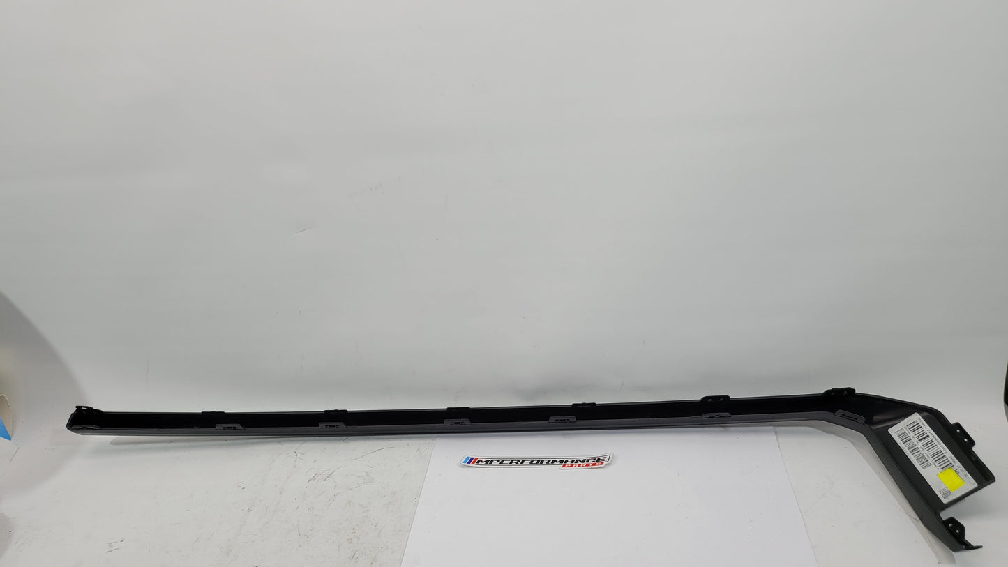BMW M3 M4 G80 G82 rear bumper left diffuser molding trim from MPerformance.parts, showing the black plastic trim piece.