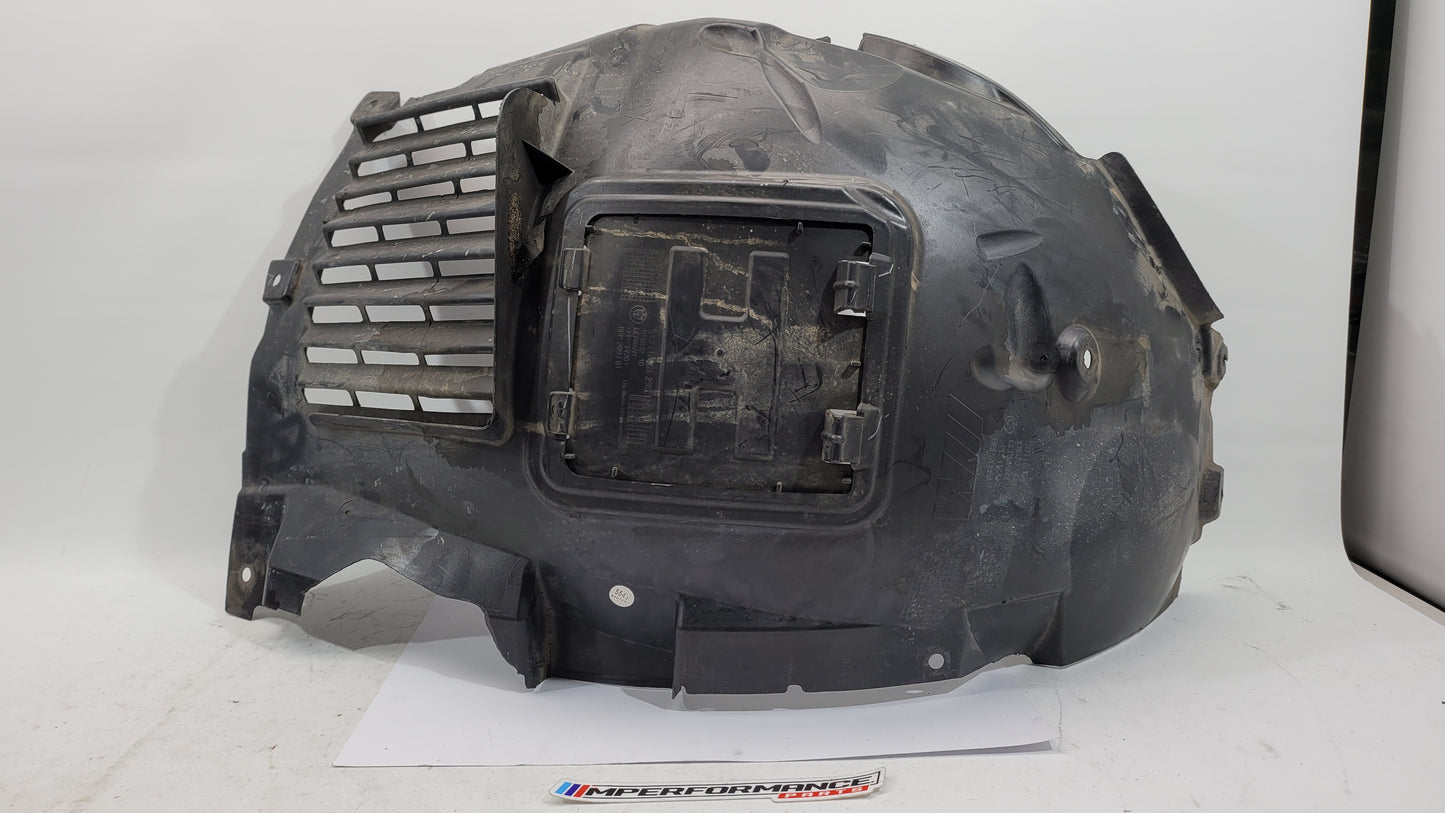 BMW F80 M3 F82 F83 M4 front inner fender liner left by MPerformance.parts, showing the black plastic shield installed in the wheel well.