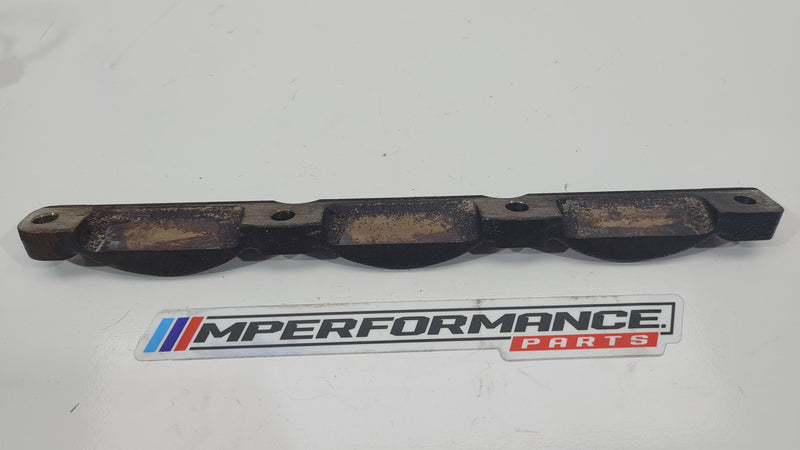 BMW G80 M3 exhaust manifold support brace bracket by MPerformance.parts, showing the metal bracket with mounting points.