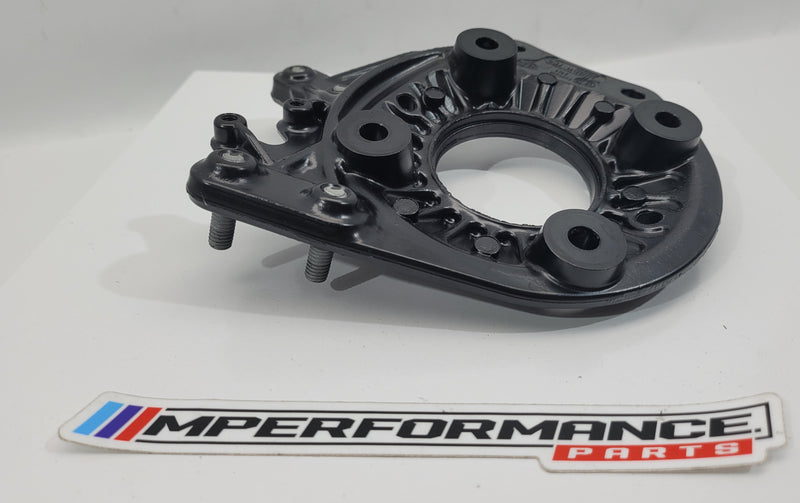 BMW M3 G80 Competition front right strut top mount by MPerformance.parts, showing the black metal mount with mounting holes.
