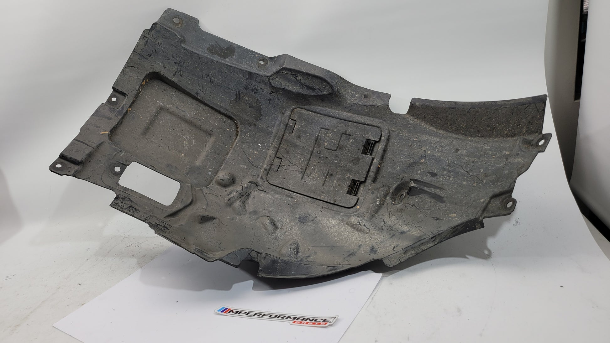 BMW 3 Series F30 F31 MSport front wheel arch liner cover left passenger side, metal and plastic construction, detailed view
