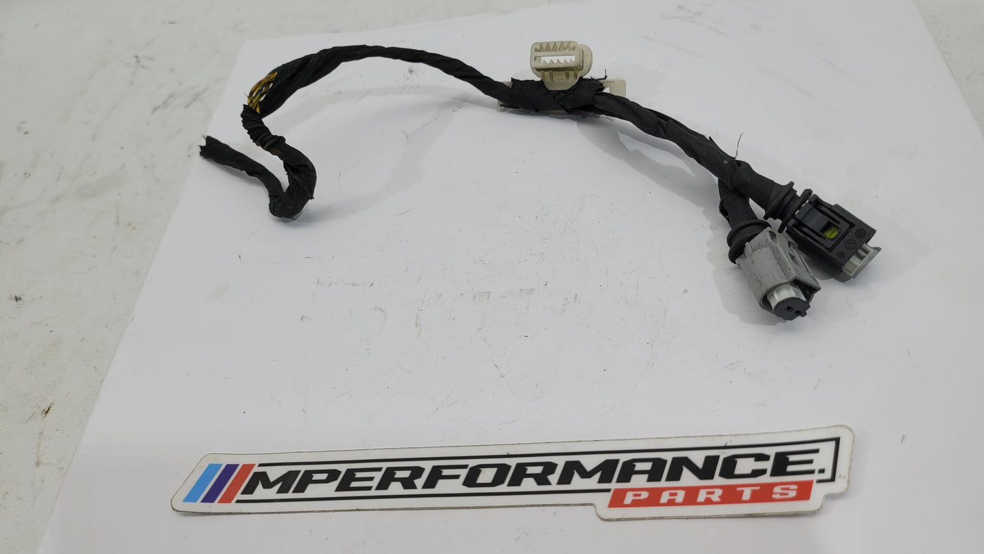 BMW wiring harness from MPerformance.parts, showing a detailed view of the black electrical cables and connectors.