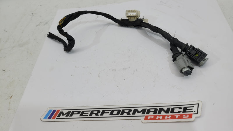 BMW wiring harness from MPerformance.parts, showing a detailed view of the black electrical cables and connectors.