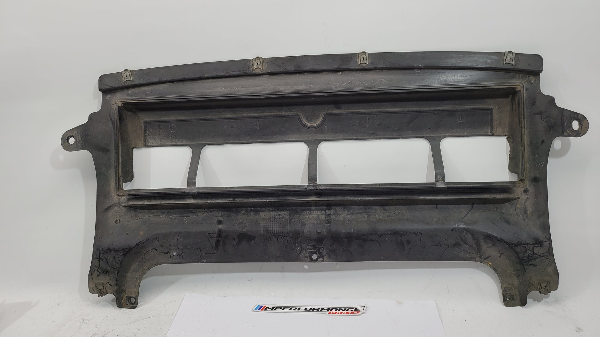 BMW M3 F80 front centre bumper belly pan from MPerformance.parts, showing the black plastic undercarriage component.