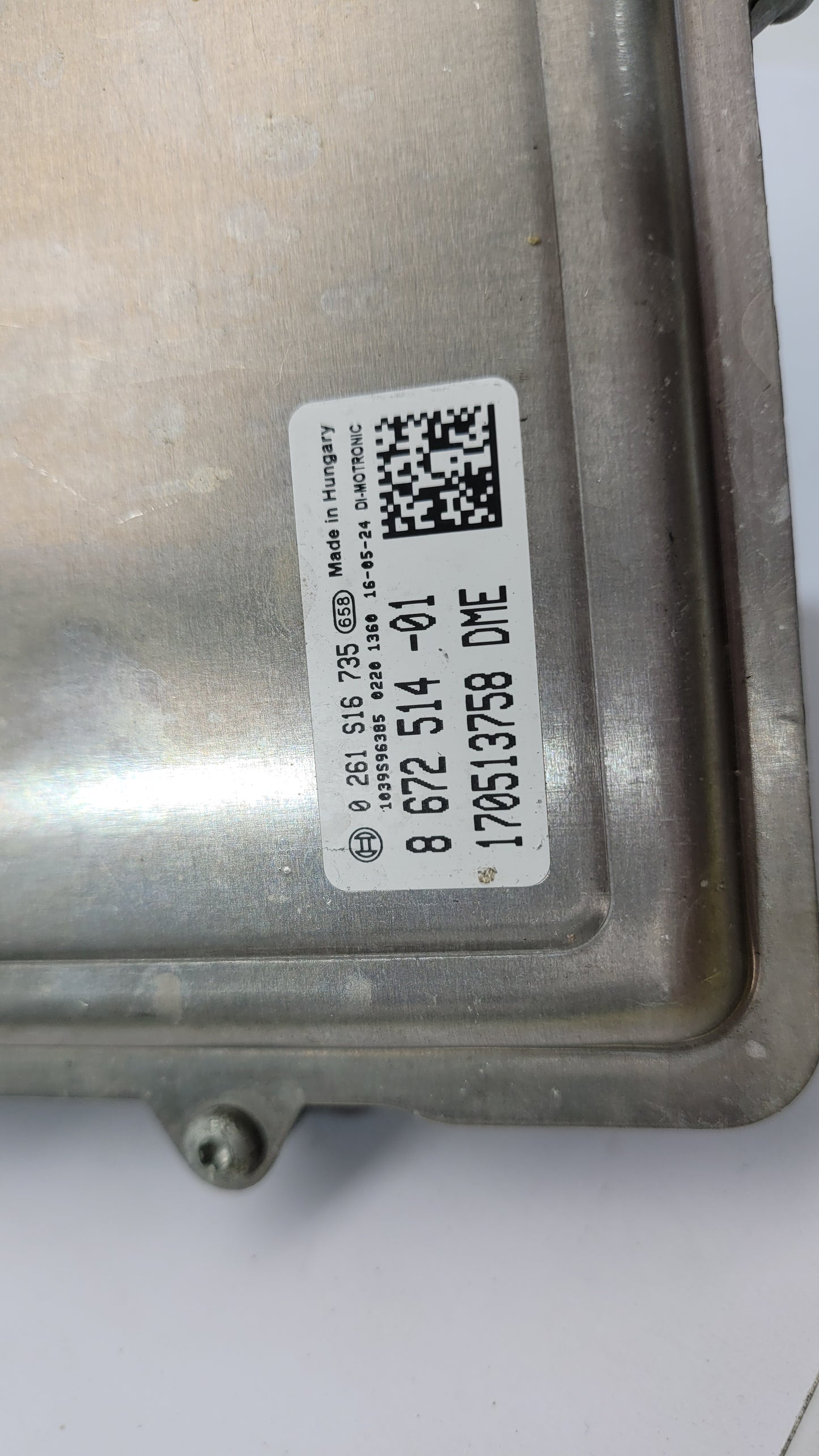 BMW M4 F82 3.0 petrol engine control module by MPerformance.parts, showing the black electronic unit with connectors.