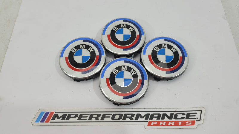BMW 50th Anniversary G80 wheel cap set of 4 by MPerformance.parts, featuring sleek black caps with anniversary emblem details.