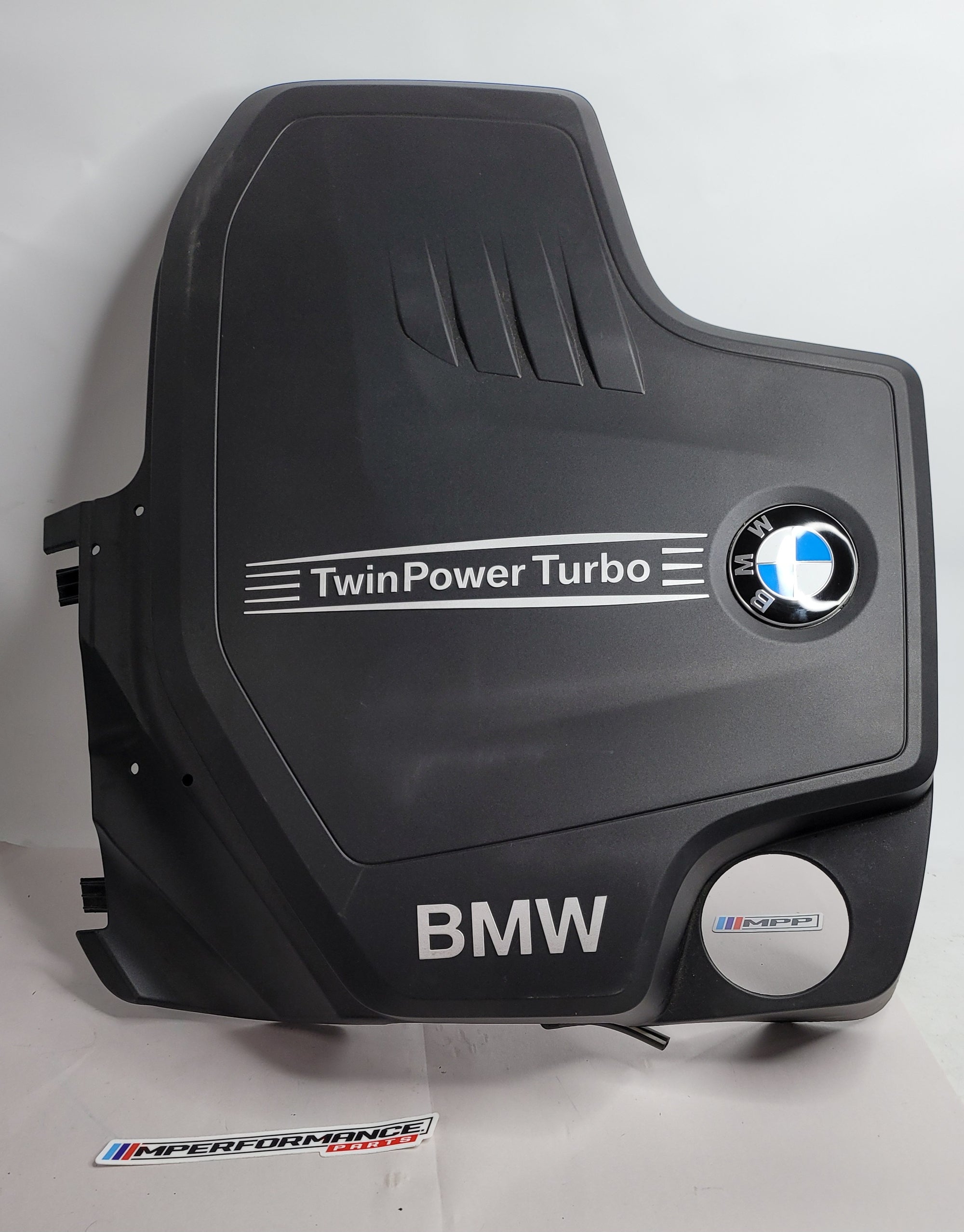 BMW 320i/328i F30 engine cover panel in black with MPerformance.parts branding, designed to fit BMW F30 engines.