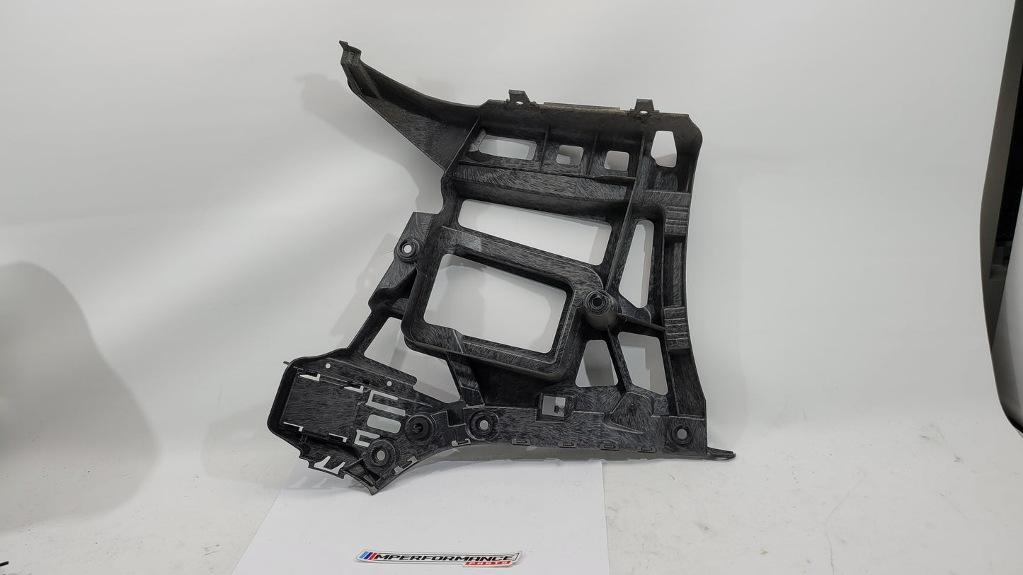 BMW M3 xDrive G80 rear bumper support bracket showing metal mounting points and structural design for vehicle stability.
