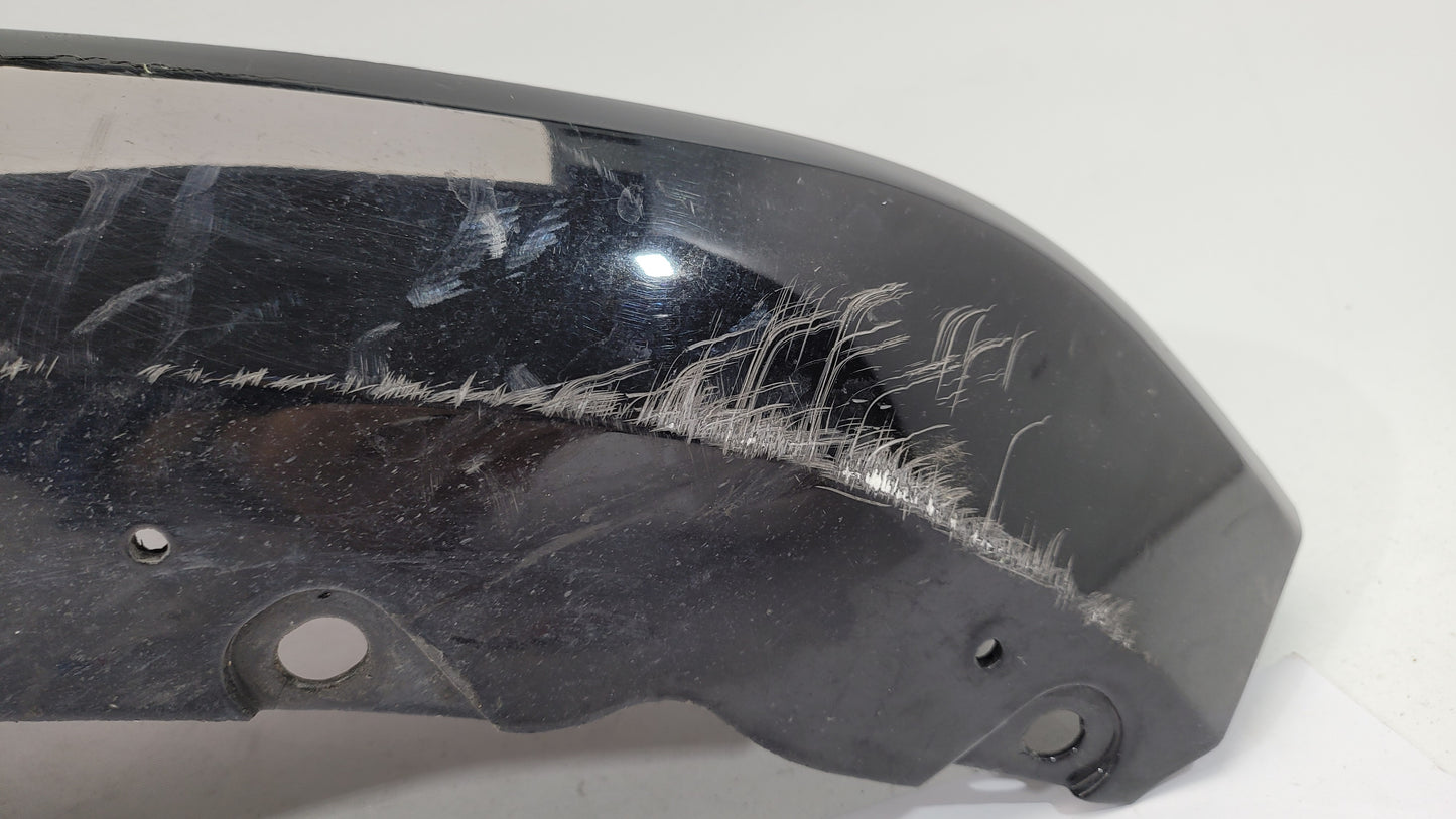 BMW G80 M3 rear bumper left corner spat splitter by MPerformance.parts, showing the black plastic aerodynamic part with mounting points.