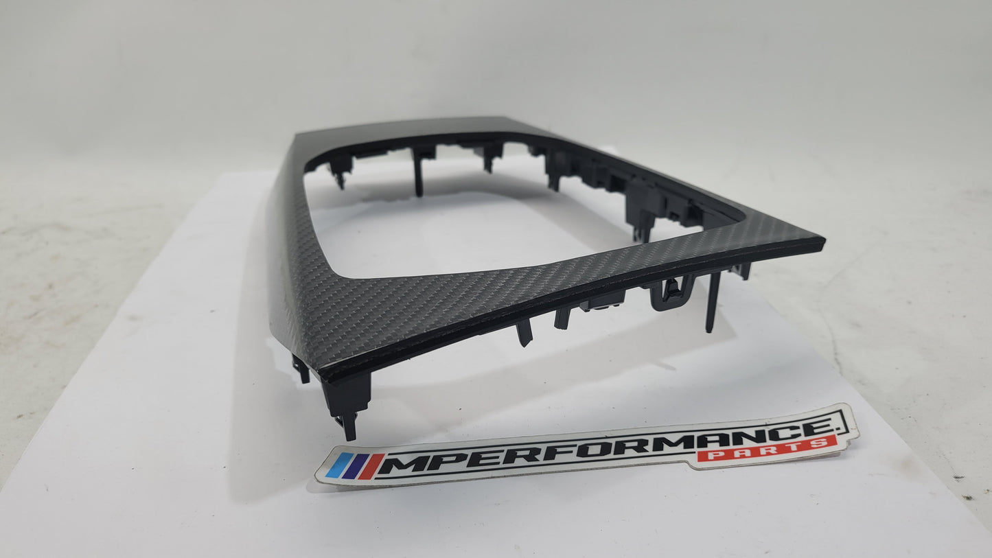 BMW M3 G80 interior carbon trim by MPerformance.parts, showcasing sleek, textured black carbon fiber accents inside the vehicle.