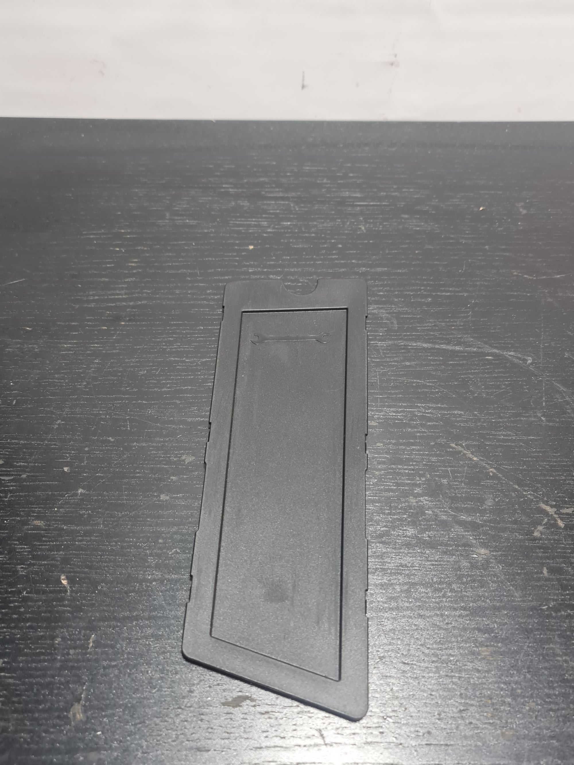 BMW G80 M3 trunk left storage compartment tray by MPerformance.parts, showing the black molded plastic interior with compartment details.