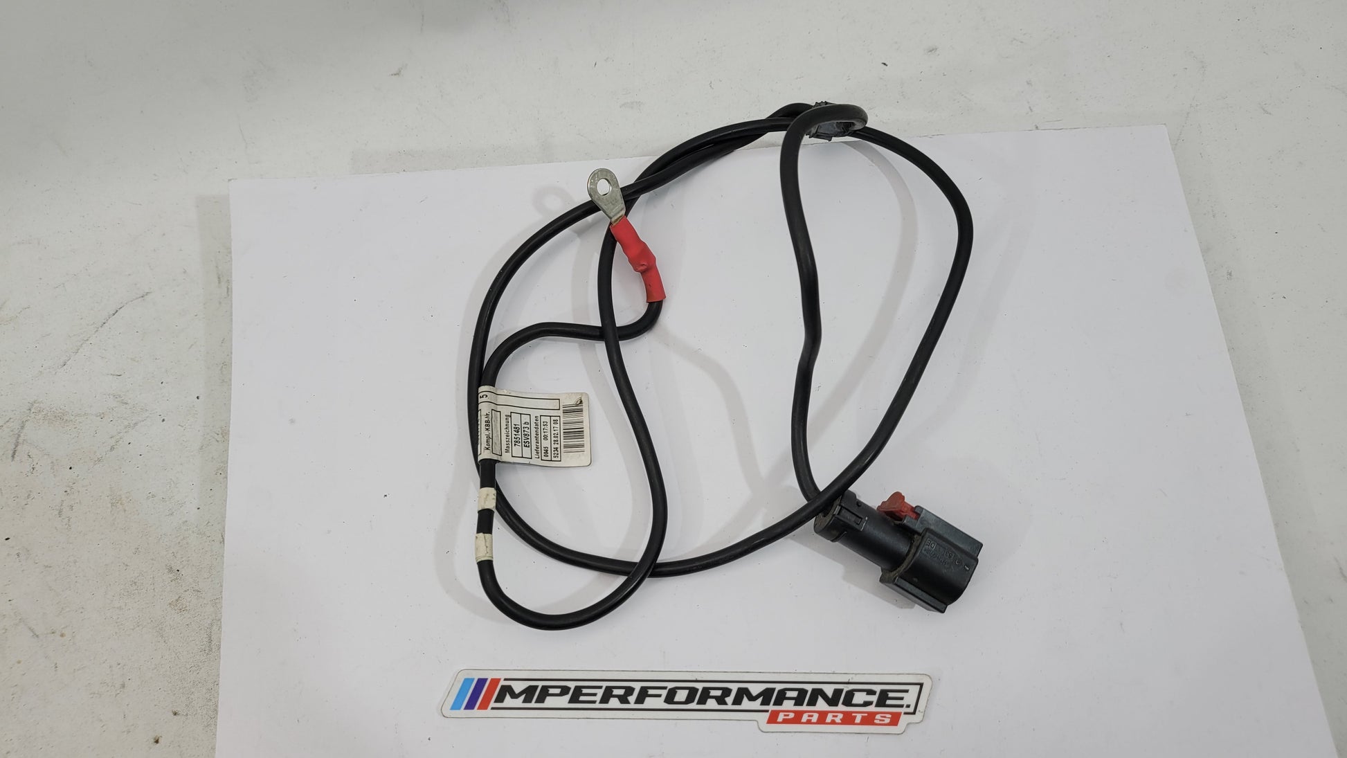 BMW F83 M4 positive battery power distribution cable by MPerformance.parts, with red and black cable connections on a metal terminal