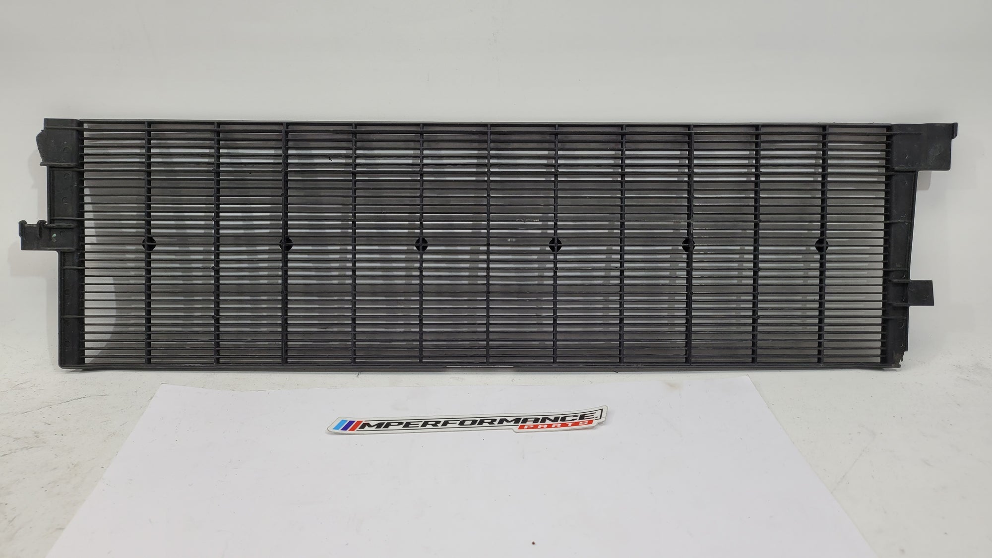 BMW G80 G82 G83 M3 M4 Competition plastic radiator cover shroud by MPerformance.parts, showing the black engine bay component.