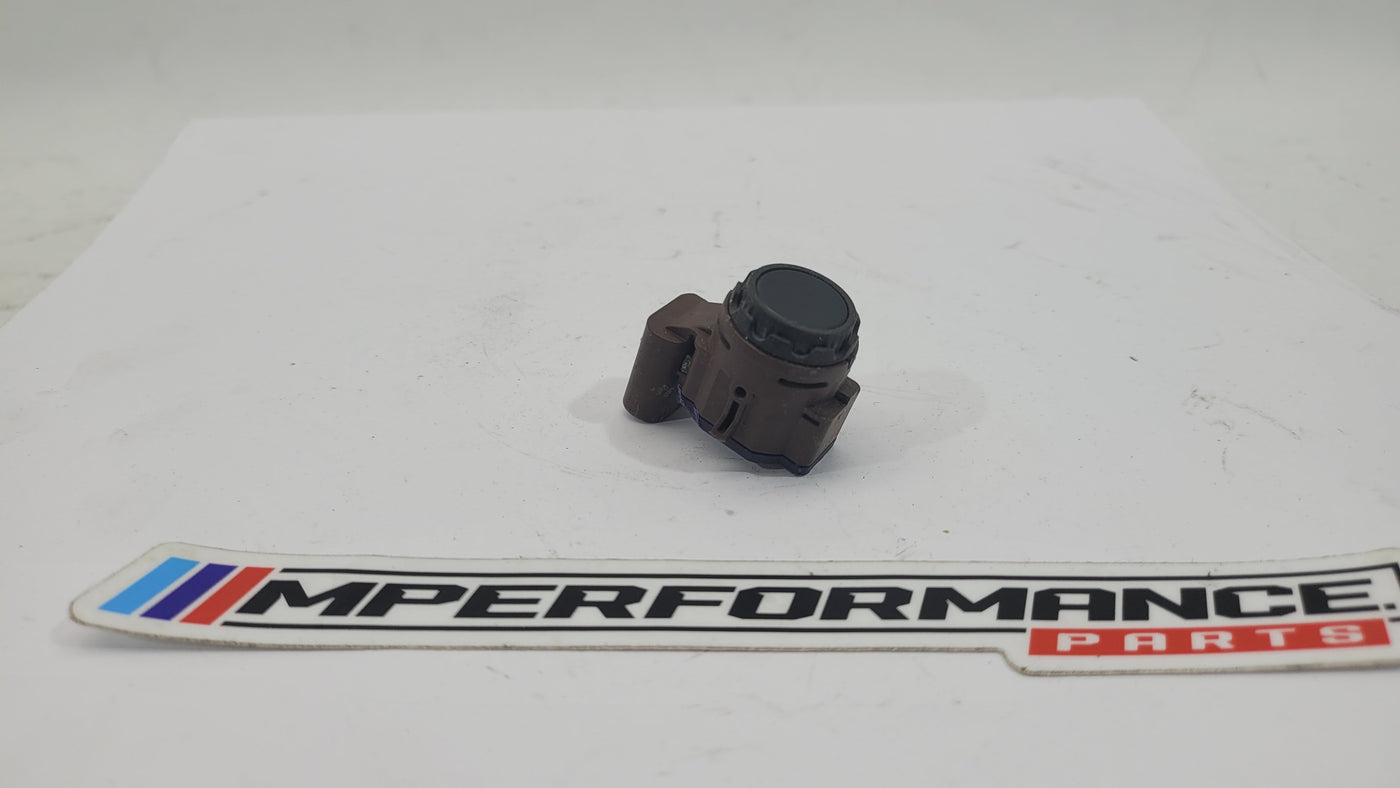 BMW M2 G87 bumper PDC parking distance sensor by MPerformance.parts, showing the sensor installed on the vehicle's bumper area.