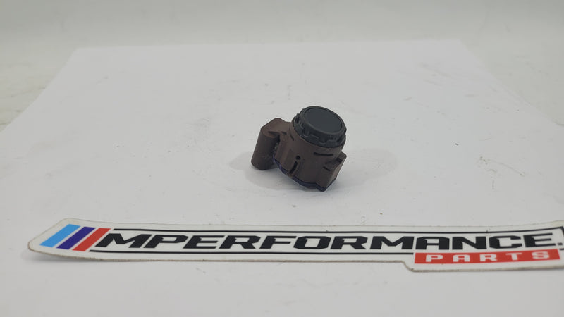 BMW M2 G87 bumper PDC parking distance sensor by MPerformance.parts, showing the sensor installed on the vehicle's bumper area.
