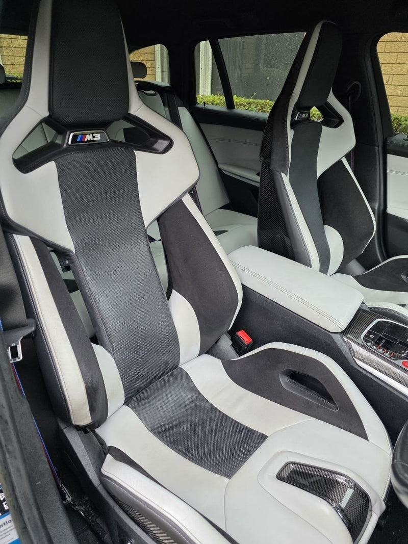 BMW G80 M3 Silverstone carbon bucket seats installed interior detail image 1