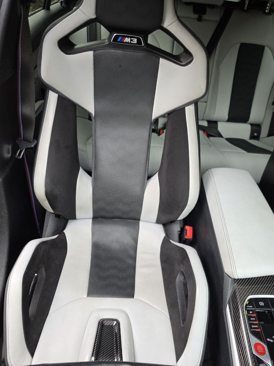BMW G80 M3 Silverstone carbon bucket seats installed interior detail image 2