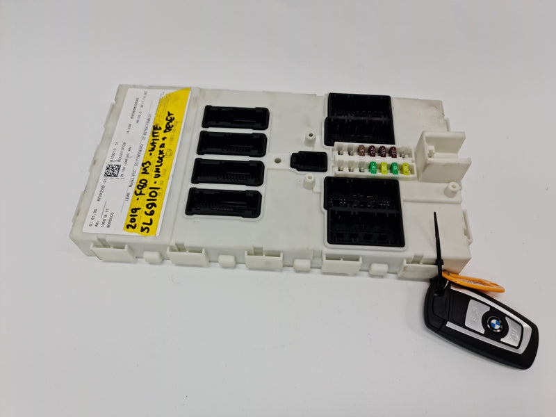 BMW F80 M3, F82 M4, F87 M2C FEM & Key module showing electronic control unit and key components.