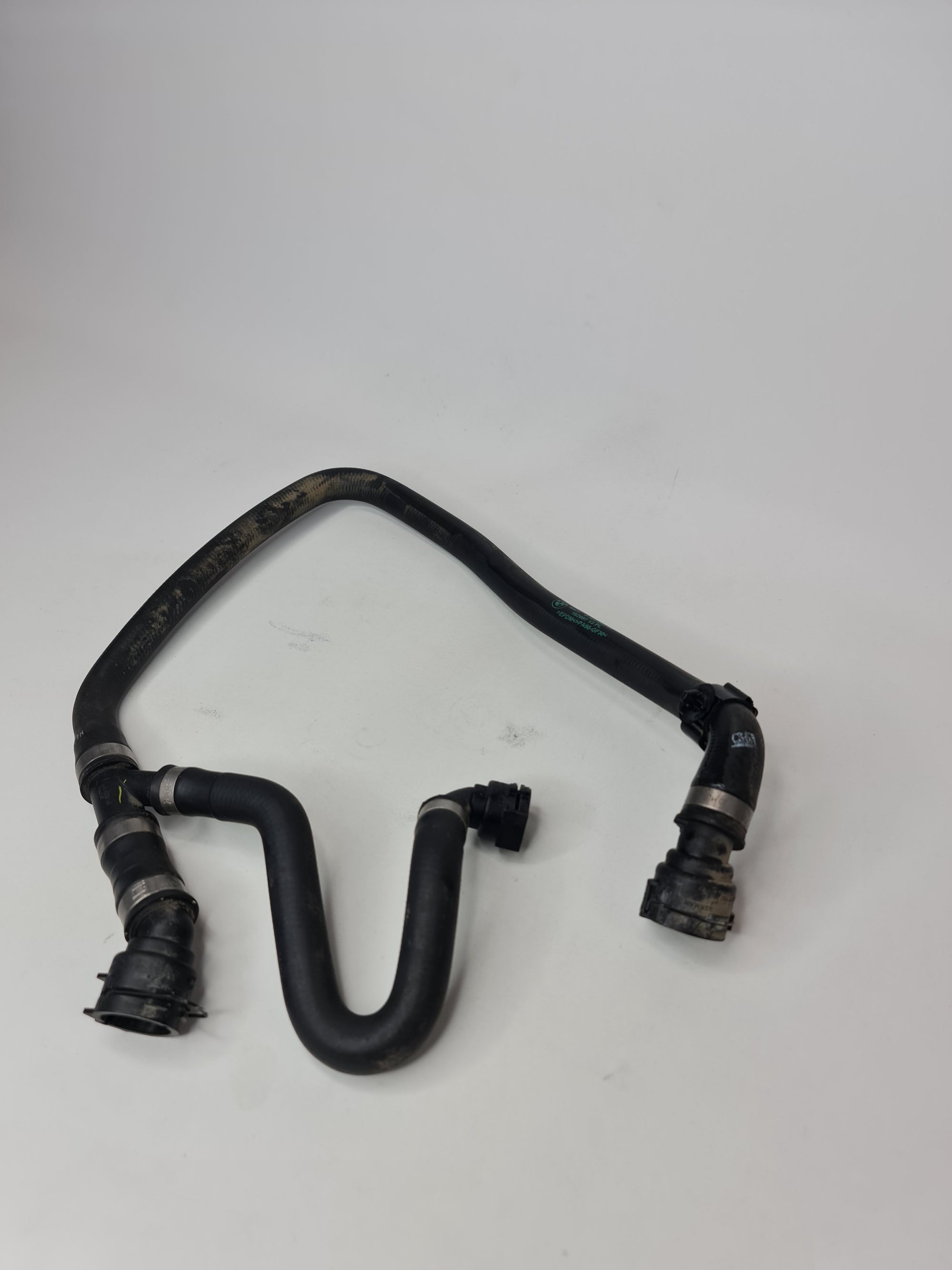 BMW radiator and engine return hose line, compatible with 2015-2020 models, black rubber replacement part with fittings.
