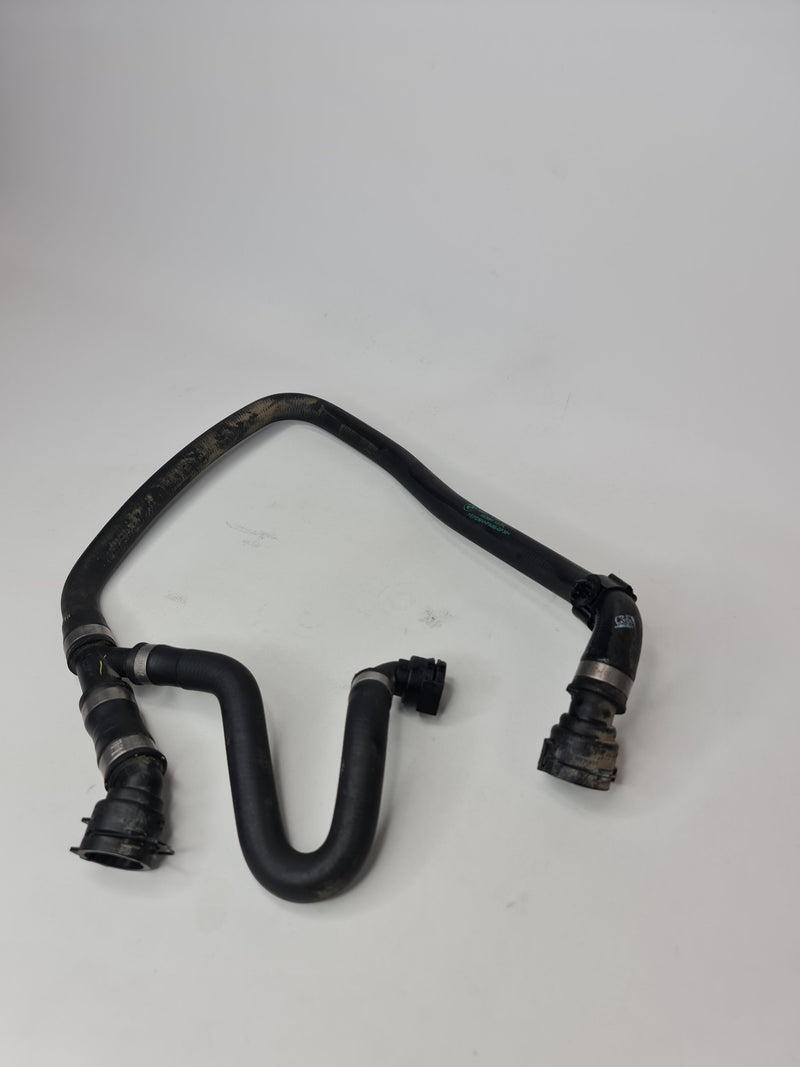 BMW radiator and engine return hose line, compatible with 2015-2020 models, black rubber replacement part with fittings.