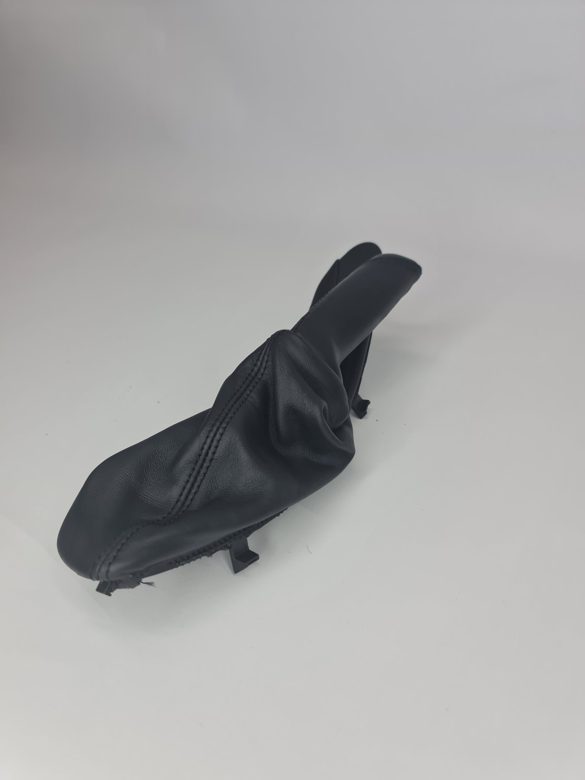 Original BMW leather handbrake lever cover, black with stitching, designed for BMW models, providing a sleek and comfortable grip.
