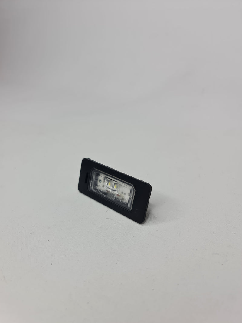 BMW LED license plate light for 2006-2020 models, bright white illumination for clear number plate visibility.