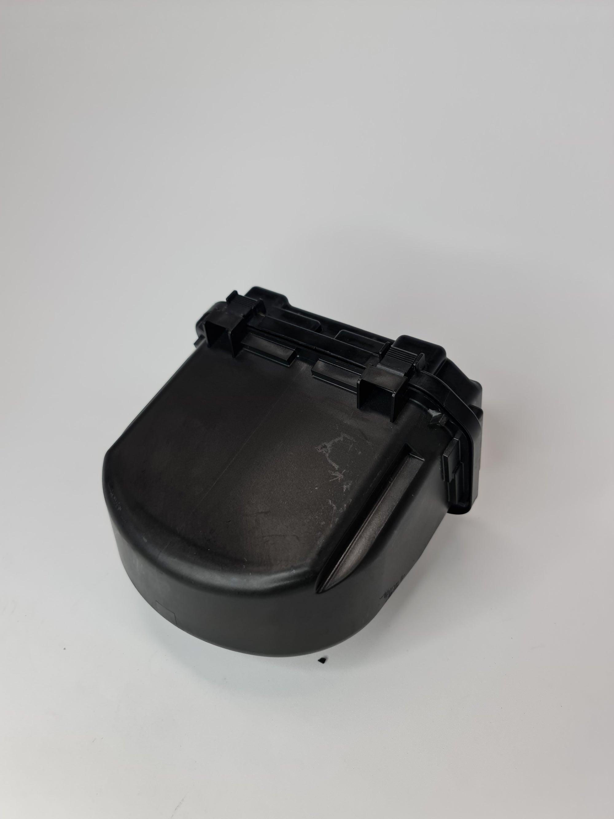 BMW 1 Series F21 M135 power distribution fuse box, black plastic with multiple fuse slots and electrical connectors.